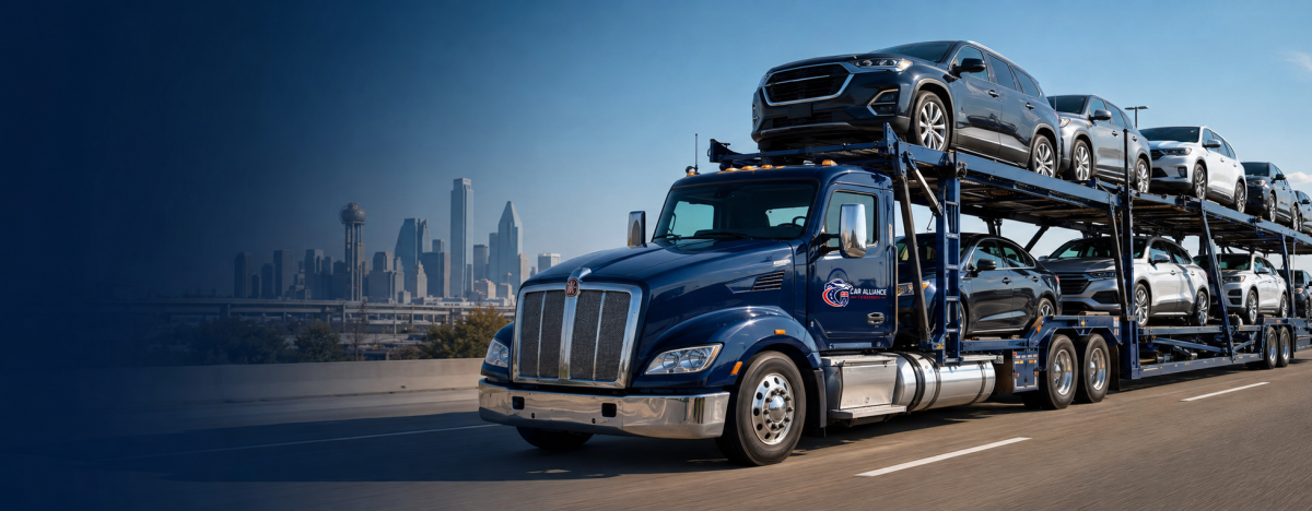 A blue car carrier truck, part of a professional Car Transport Dallas TX service, transports multiple vehicles on a highway with a city skyline and clear blue sky in the background.